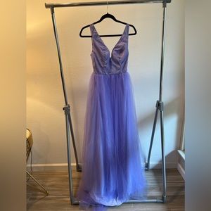 Purple floor length gown with deep V and slit. Never worn! Tags on!